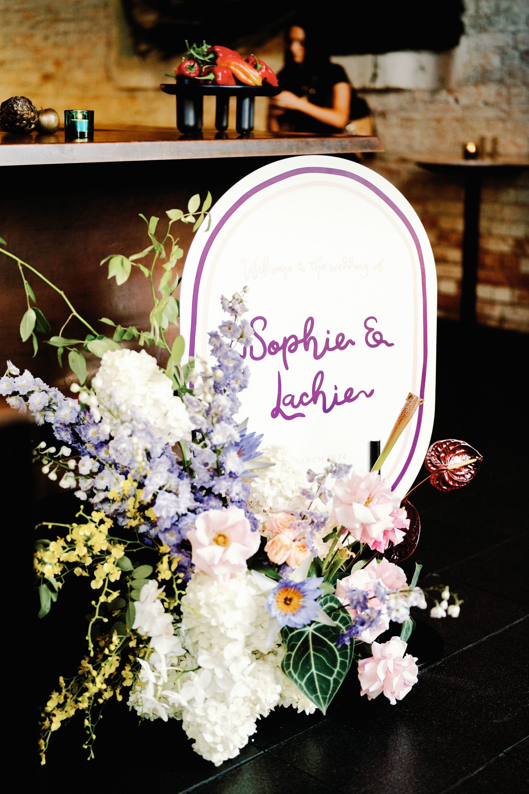 Entrance signboard for Sophia & Lachie's chic city wedding.